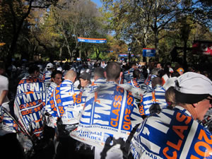 Finishers continue walking out of the finishing area.